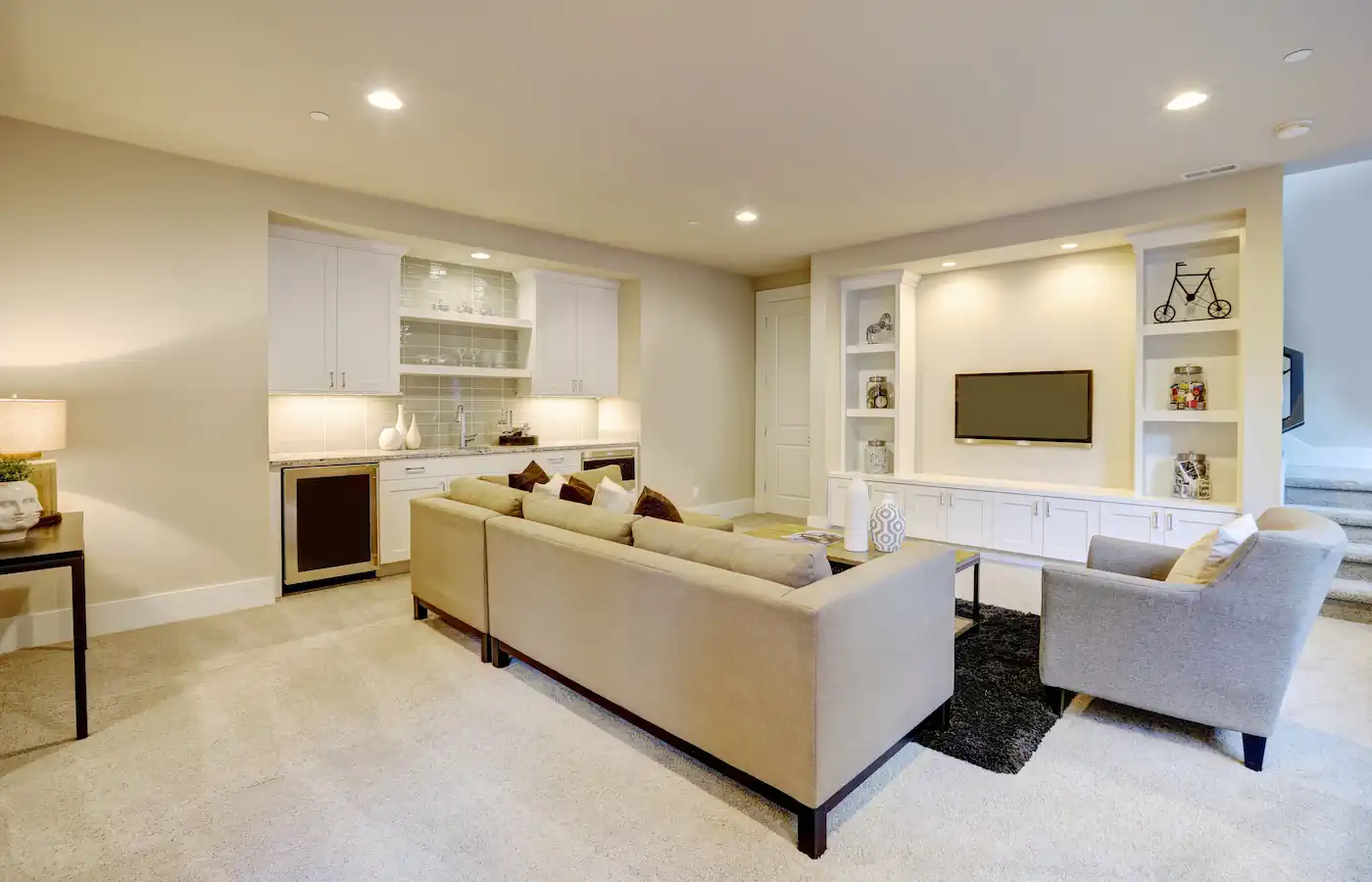 Finished basement with built in wet bar and built in shelves