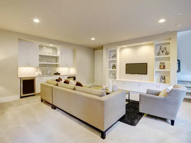 Finished basement with built in wet bar and built in shelves