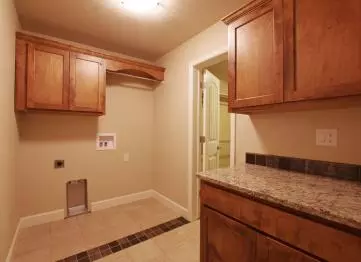 Having a counter to fold clothes in the laundry room makes doing laundry so much easier.
