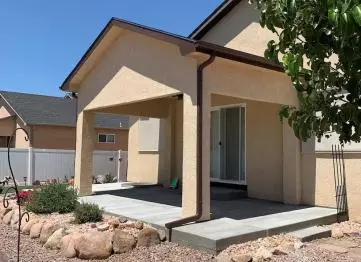 Sky Creek Homes added a roof over this patio making it a covered patio.